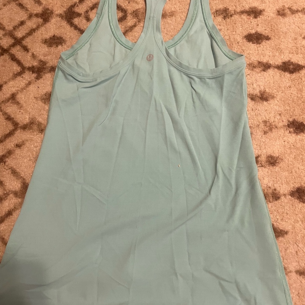 lululemon teal tank top. hip length